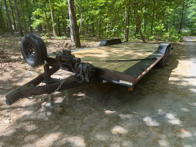Flatbed Utility Trailer in Forested Area, Ideal for Trailer Rentals Asheboro NC